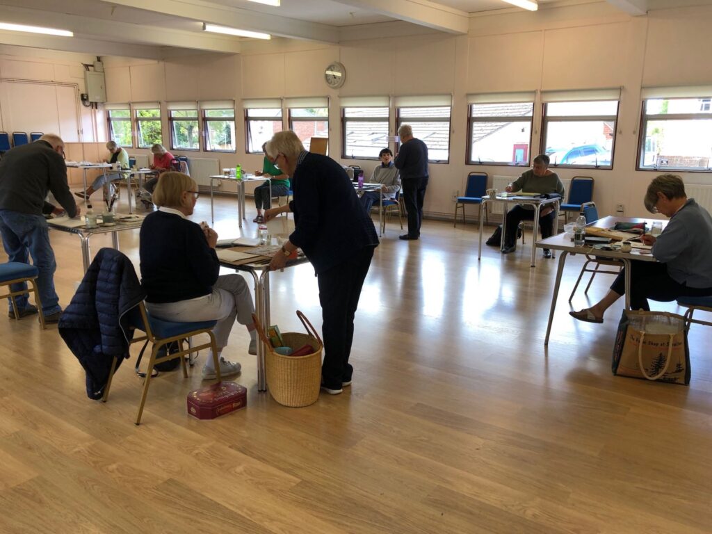 Art group sitting drawing and painting