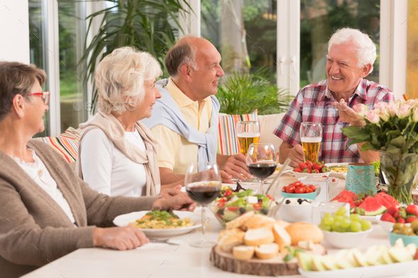 An image of several people enjoying a meal
